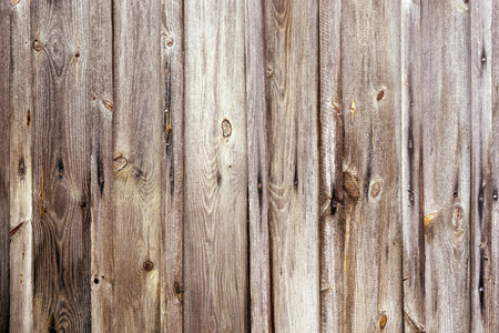 Weathered wooden fence texture with rusty nail headsの写真素材