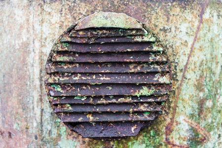 old rusty metal industrial circular Ventilation Grillの写真素材
