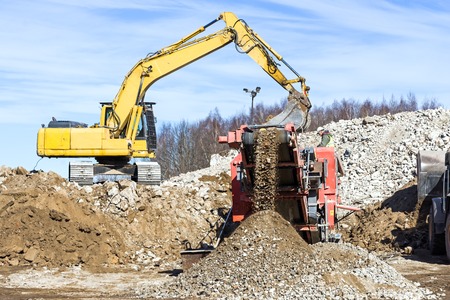 Crawler Mobile Crusher and excavator Crushing concreteの写真素材