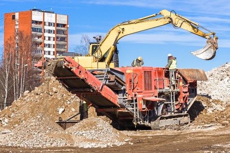 Crawler Mobile Crusher and excavator Crushing concreteの写真素材