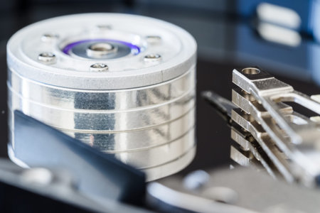 Hard disk drive inside close-up, spindle, actuator arm, read write head, platter