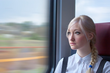 Businesswoman in trainの写真素材