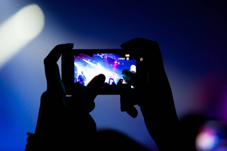 Concert video recording with cell phoneの写真素材
