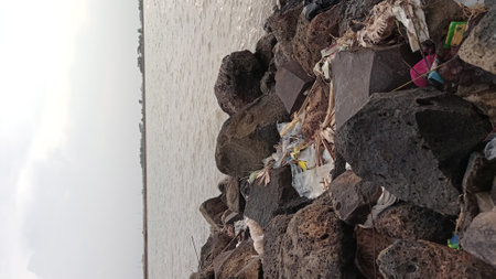 Pile of garbage on the wall with white sky background. Selective focus.の写真素材