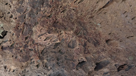close up of a stone texture with holes in it, can be used as a backgroundの写真素材