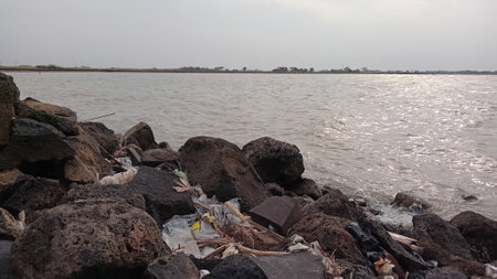 Garbage on the banks of the Mekong River in Laos.の写真素材