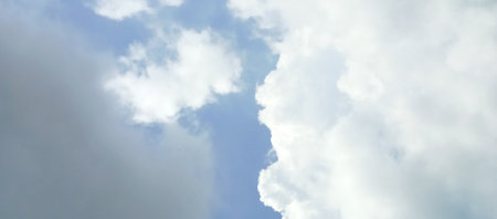 blue sky background with white clouds. Sky clouds. White fluffy clouds in the blue sky.の写真素材