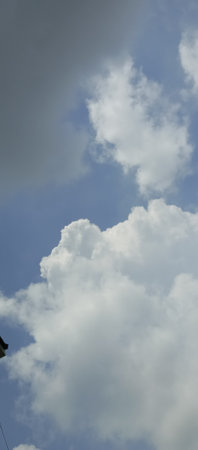 Clouds in the blue skybe used as background.の写真素材