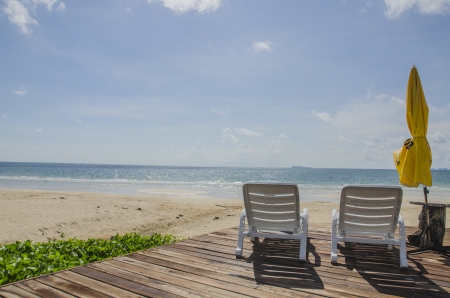 Beach scene with chairs and umbrellaの写真素材