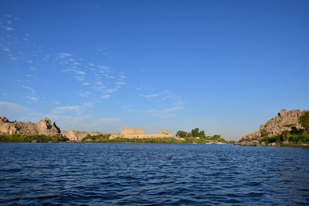 Ancient pharaohs Philae temple in Aswan Egypt in the river nile , old temple have hieroglyphs craved in its stones/Trajan's Kiosk / obelisk , Ancient Egyptのeditorial素材