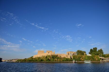 Ancient pharaohs Philae temple in Aswan Egypt in the river nile , old temple have hieroglyphs craved in its stones/Trajan's Kiosk / obelisk , Ancient Egyptのeditorial素材