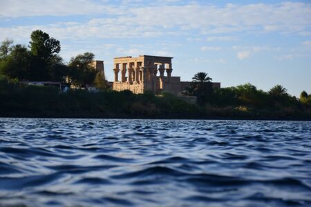 Ancient pharaohs Philae temple in Aswan Egypt in the river nile , old temple have hieroglyphs craved in its stones/Trajan's Kiosk / obelisk , Ancient Egyptのeditorial素材