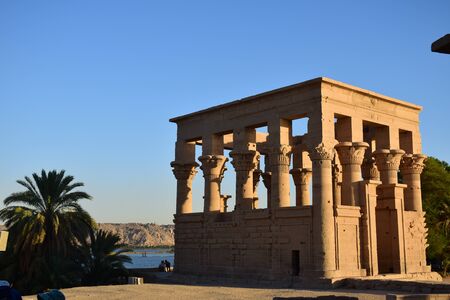 Ancient pharaohs Philae temple in Aswan Egypt in the river nile , old temple have hieroglyphs craved in its stones/Trajan's Kiosk / obelisk , Ancient Egyptのeditorial素材