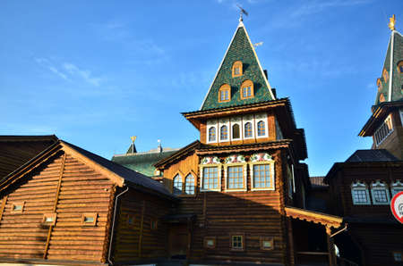 Wooden Palace Of Moscow Kolomenskoye - colorful Tourism landmark attractions in Russia - royal old palace with golden cyan brown green white colors made out of woodのeditorial素材