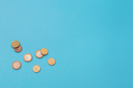 Euro coins on a blue background