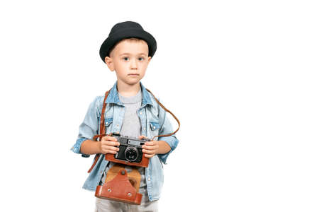 Photographer boy, child with vintage retro cameraの写真素材