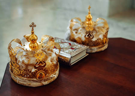 Two crowns and bible on holy altar for the wedding ceremony in the Russianの写真素材