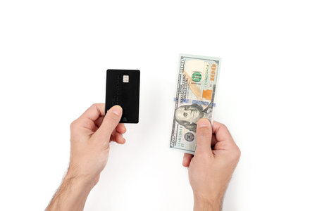 Men's hands holding credit or debit card and one hundred banknote. Finance and wealthy concept....