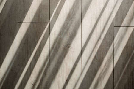 Organic drop diagonal shadow on a gray floor. White and Black for overlaying a photo, mock up, posters, stationary, wall art, design presentation. Blinds shade on a laminateの写真素材