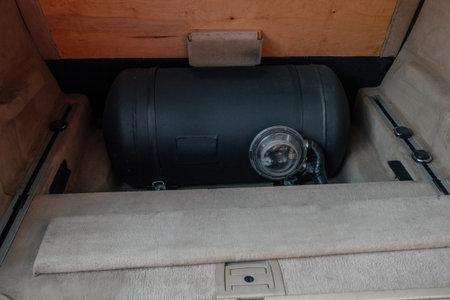 Gas tanks installed in a modern car for the 2 fuel system. Automobile LPG gas tanks. Car run by...