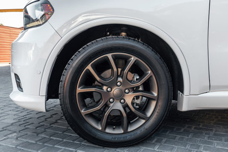 Ukraine, Odessa July 8 - 2021: Modern automotive wheel on light alloy disc. Dodge rims with logo....