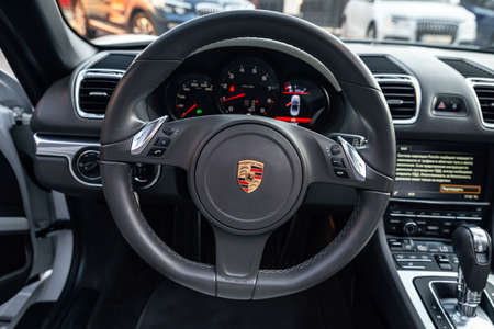 Ukraine, Odessa September 8 - 2021: Porsche 718 Boxter steering wheel. View of Porsche logo on car steering wheel.のeditorial素材