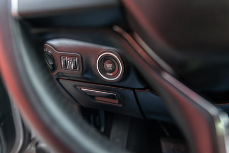 Button engine start and engine stop. Car inside. Ignition remote starter. Modern car interior...