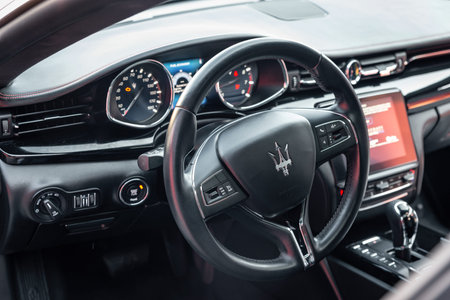 Ukraine, Odessa September 8 - 2021: Interior of modern luxury car Maserati Ghibli. Cockpit with...