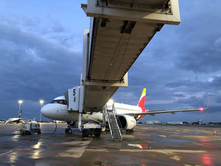 Airplane connected to a boarding gangway at Seville Airportのeditorial素材