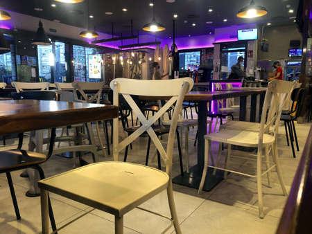Empty tables and chairs in a fast food restaurantのeditorial素材