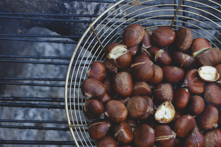 Fire-roasted chestnuts, in Catalonia it is a tradition to eat them on All Saints' Dayの写真素材