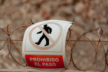 No Entry Sign on Barbed Wire Fenceの写真素材
