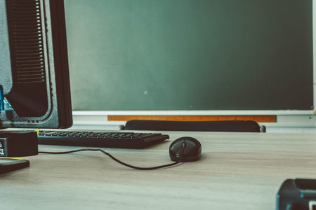 Computer Desk with Keyboard and Mouse in Classroom