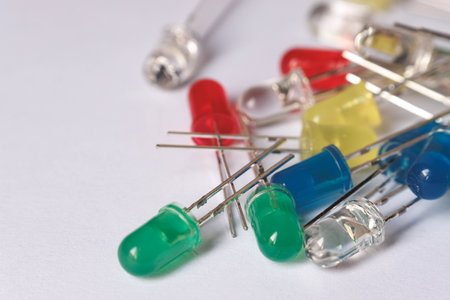 Colorful LED diodes scattered on white backgroundの写真素材