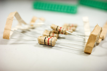 Electronic beige resistors with colored bands on neutral backgroundの写真素材