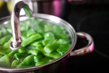Fresh green beans cooking in stainless steel potの写真素材
