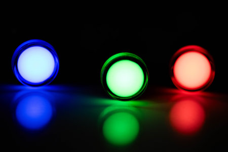 Blue Green and Red LED Indicator Lights Aligned on Dark Background