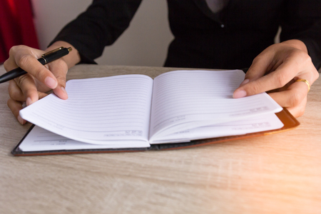 People with calculator counting making finances and calculate on desk about cost at home office.の写真素材