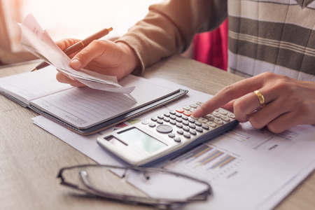 Businesswomen working with calculator at office,Finance managers task,Concept business and financeの写真素材