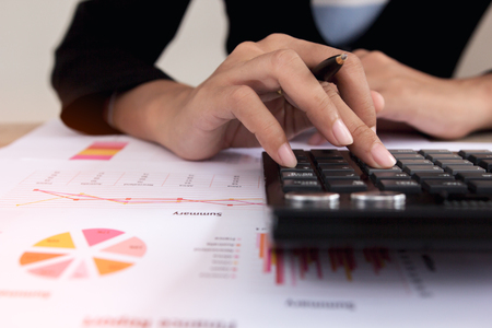 Businesswoman calculate about cost and doing finance at home office, Finance managers task,Concept business and finance investmentの写真素材