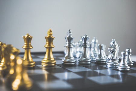 Chess board game concept of business ideas and competition and stratagy plan success meaning, Stock financial statistic graph analysis data concept.の写真素材