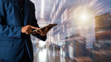 Industry 4.0 concept Logistic and transport concept : Businessman manager using tablet check and control and planning for Modern Trade warehouse logistics.の写真素材