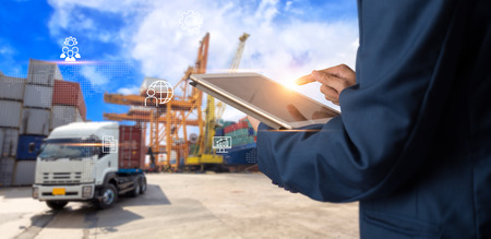 Business Logistics concept, Businessman manager using tablet check and control for workers with Modern Trade warehouse logistics. Industry 4.0 conceptの写真素材