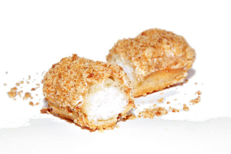 An appetizing eclair with a delicious cream 