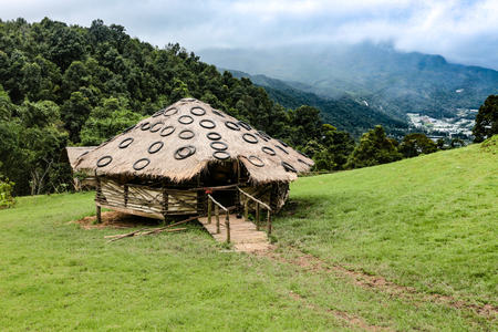 House of sheep made of wood and straw on a farm on a high hill.の写真素材