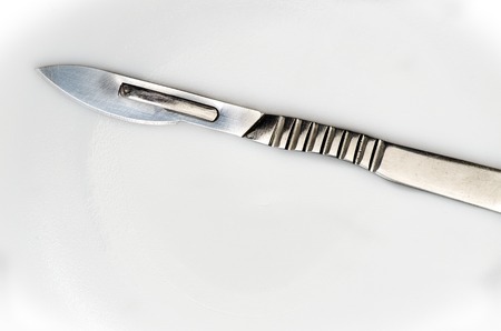 surgical scalpel with replaceable blades on a white backgroundの写真素材