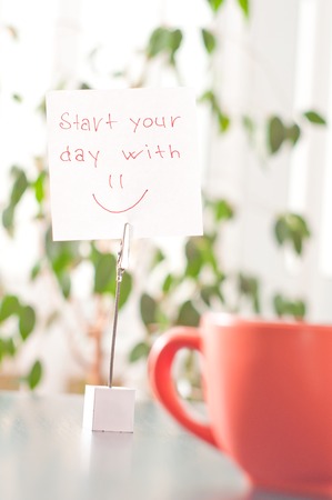 a note on the table start your day with a smileの写真素材