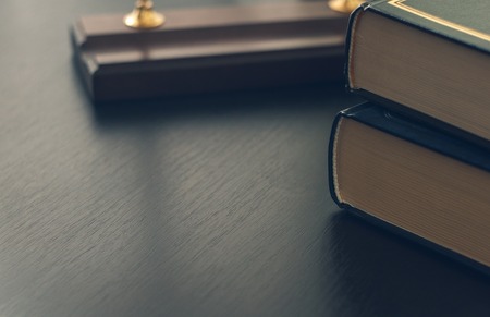 Vintage old books on wooden deck table and grunge background.の写真素材