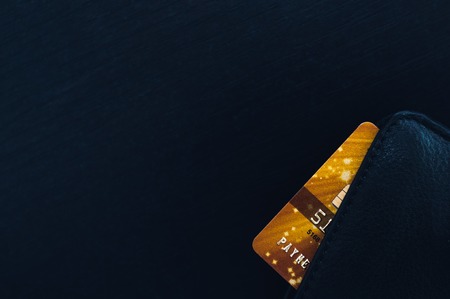 Black leather wallet with credit and discount cards.の写真素材