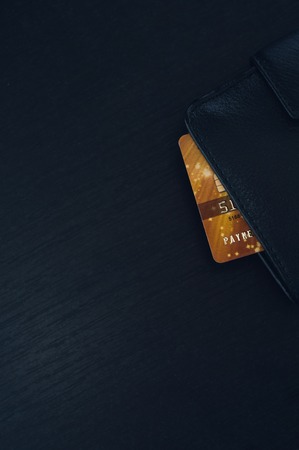 Black leather wallet with credit and discount cards.の写真素材